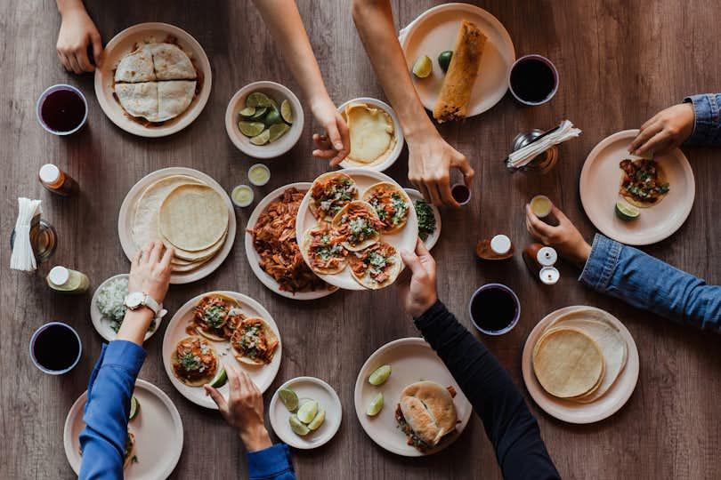 Tacos al Pastor, Group of People eating in a Taqueria, Tacos top view