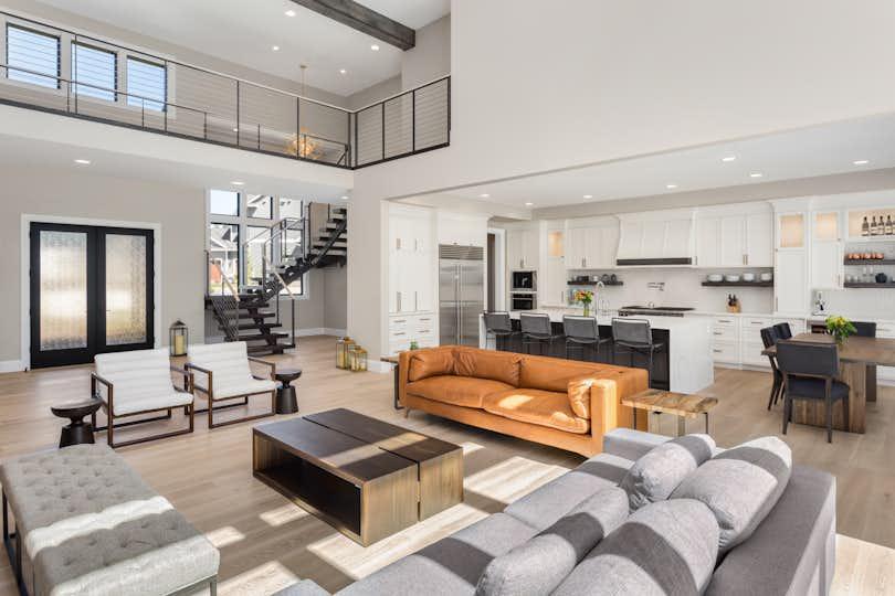 Living Room in Open Concept New Luxury Home with View of Entry, Kitchen, and Second Floor